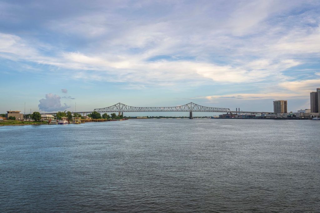 Bridge spanning the Mississippi River under a cloudy sky