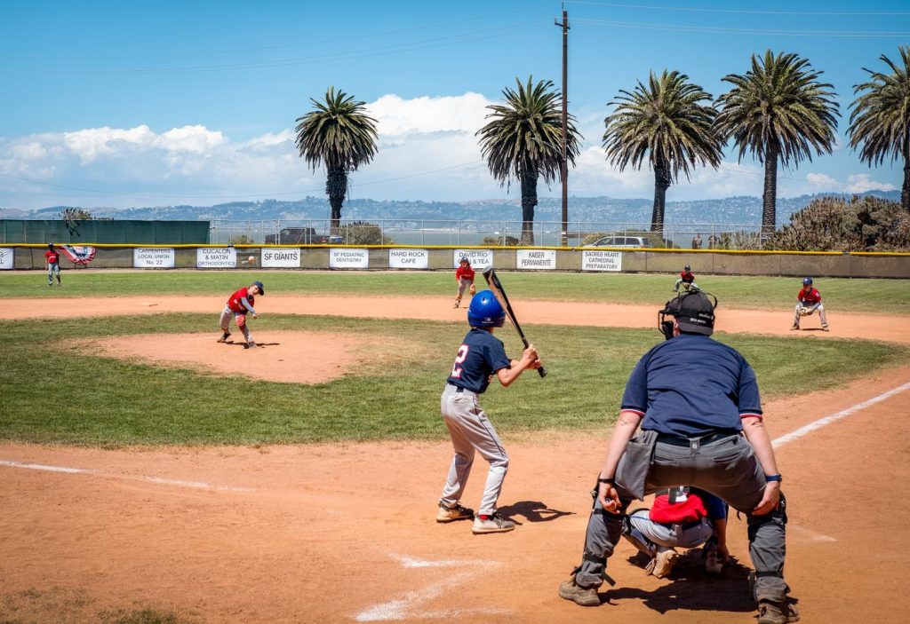 Youth baseball game on a sunny field